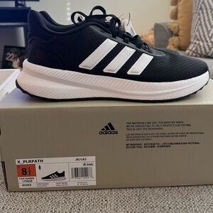 Adidas Unisex Black Running Shoes NWT
Women’s 8.5 Men’s 7